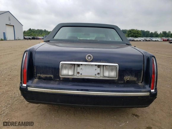 1997 Cadillac DeVille with VIN 1G6KD54Y2VU300250, listed as a Copart auction lot 66253444 with 0 mi miles and Clean Title. Bid and sale history available at carsss.com. Image 6.