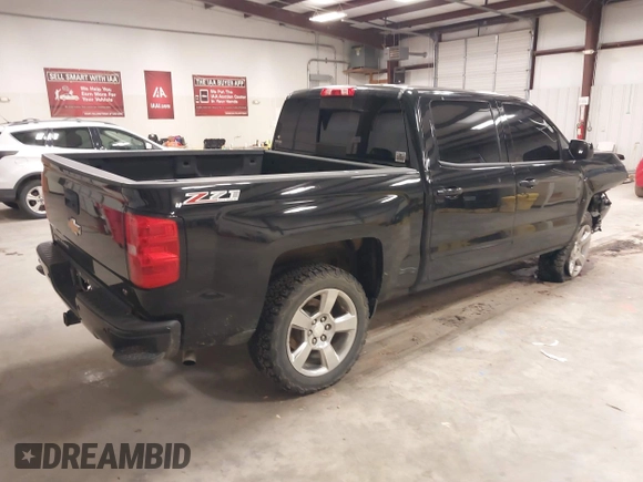 2017 Chevrolet Silverado 1500 LT with VIN 3GCUKREC6HG501307, listed as a IAAI auction lot 41611899 with 133,863 mi miles and . Bid and sale history available at DreamBid. Image 4.