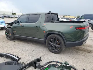 2023 Rivian R1T Adventure z VIN 7FCTGAAA8PN001040, wystawiony jako Copart lot #71517874 z przebiegiem 19 789 mil mil oraz Szkody całkowita. Historia ofert i sprzedaży dostępna na DreamBid. Obrazek 2.
