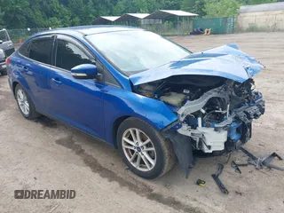 2018 Ford Focus SE z VIN 1FADP3F20JL214127, wystawiony jako IAAI lot #42291459 z przebiegiem 82 194 mil mil oraz . Historia ofert i sprzedaży dostępna na DreamBid. Obrazek 1.