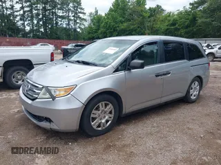 2011 Honda Odyssey LX with VIN 5FNRL5H26BB027144, listed as a IAAI auction lot 42456465 with 201,901 mi miles and . Bid and sale history available at DreamBid. Image 2.