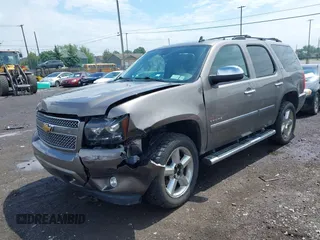 2013 Chevrolet Tahoe LTZ with VIN 1GNSKCE0XDR373858, listed as a IAAI auction lot 42456875 with 297,084 mi miles and . Bid and sale history available at DreamBid. Image 2.