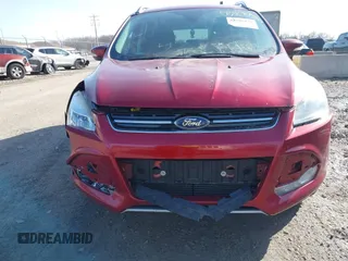 2015 Ford Escape Titanium z VIN 1FMCU9J9XFUC75357, wystawiony jako IAAI lot #41705474 z przebiegiem 198 381 mil mil oraz . Historia ofert i sprzedaży dostępna na DreamBid. Obrazek 12.
