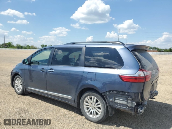 2015 Toyota Sienna XLE with VIN 5TDYK3DC4FS619385, listed as a Copart auction lot 57090385 with 112,896 mi miles and Salvage title. Bid and sale history available at DreamBid. Image 2.