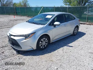 2021 Toyota Corolla Hybrid LE with VIN JTDEAMDE5MJ022110, listed as a IAAI auction lot 41912920 with 59,198 mi miles. Bid and sale history available at carsss.com. Image 18.