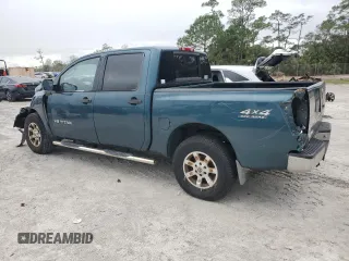2006 Nissan Titan LE z VIN 1N6BA07B16N557411, wystawiony jako Copart lot #86058634 z przebiegiem 263 198 mil mil oraz Szkody całkowita. Historia ofert i sprzedaży dostępna na DreamBid. Obrazek 2.