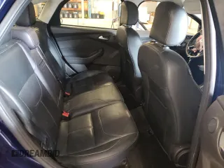 2016 Ford Focus Titanium z VIN 1FADP3J27GL310367, wystawiony jako Copart lot #55048005 z przebiegiem 86 676 mil mil oraz Szkoda całkowita • Salvage title. Historia ofert i sprzedaży dostępna na DreamBid. Obrazek 10.