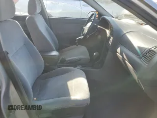 2001 Kia Sephia z VIN KNAFB121715014673, wystawiony jako Copart lot #71712174 z przebiegiem 83 277 mil mil oraz Szkody całkowita. Historia ofert i sprzedaży dostępna na DreamBid. Obrazek 7.