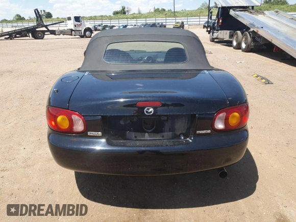 1999 Mazda MX-5 Miata with VIN JM1NB3535X0119662, listed as a Copart auction lot 61870445 with 84,787 mi miles and Clean title. Bid and sale history available at DreamBid. Image 6.