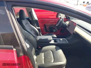 2021 Tesla Model 3 Long Range with VIN 5YJ3E1EBXMF928002, listed as a IAAI auction lot 42003092 with 25,867 mi miles. Bid and sale history available at carsss.com. Image 4.