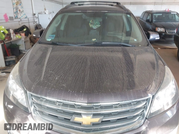 2015 Chevrolet Traverse LT with VIN 1GNKRGKDXFJ371359, listed as a IAAI auction lot 42691574 with Not provided miles and . Bid and sale history available at DreamBid. Image 12.
