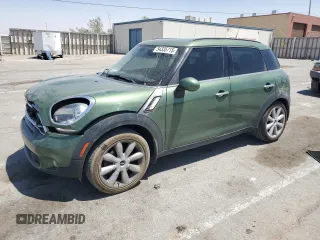 2015 MINI Countryman S with VIN WMWZC3C58FWT01545, listed as a Copart auction lot 54335715 with 84,758 mi miles and Salvage title. Bid and sale history available at DreamBid. Image 1.