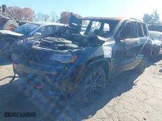 2021 Jeep Grand Cherokee Laredo X with VIN 1C4RJEAGXMC597580, listed as a IAAI auction lot 40999568 with 1 mi miles. Bid and sale history available at carsss.com. Image 2.
