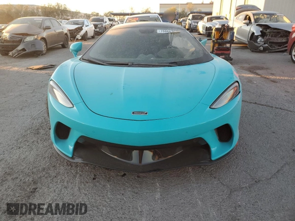 2023 McLaren GT z VIN SBM22GCA0PW002765, wystawiony jako Copart lot #78866364 z przebiegiem Nie podano mil oraz Szkody całkowita. Historia ofert i sprzedaży dostępna na DreamBid. Obrazek 5.