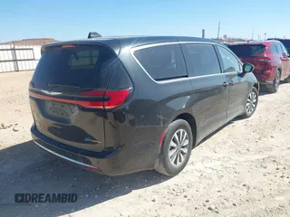 2023 Chrysler Pacifica Hybrid Touring L with VIN 2C4RC1L75PR611901, listed as a IAAI auction lot 41510935 with 44,156 mi miles and . Bid and sale history available at DreamBid. Image 4.