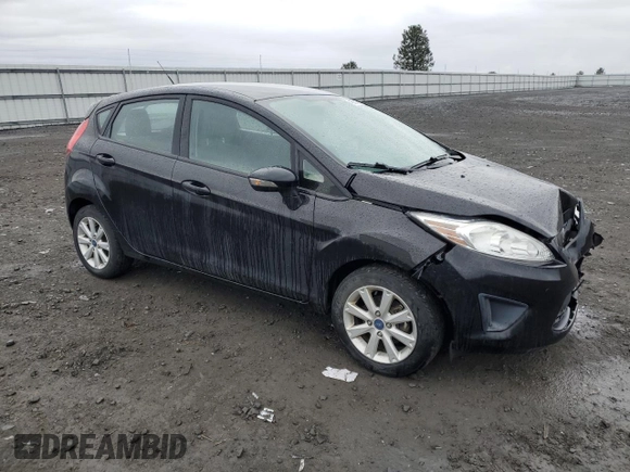 2013 Ford Fiesta SE with VIN 3FADP4EJ5DM119614, listed as a Copart auction lot 48731575 with 64,676 mi miles and Salvage Title. Bid and sale history available at carsss.com. Image 4.