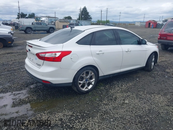 2014 Ford Focus Titanium with VIN 1FADP3J27EL142095, listed as a IAAI auction lot 42004419 with 139,515 mi miles. Bid and sale history available at carsss.com. Image 4.