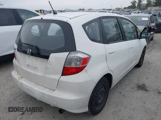2013 Honda Fit with VIN JHMGE8H30DC067178, listed as a IAAI auction lot 41498926 with 121,036 mi miles. Bid and sale history available at carsss.com. Image 4.