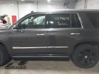2015 Cadillac Escalade Premium z VIN 1GYS4CKJ8FR308617, wystawiony jako IAAI lot #41974608 z przebiegiem 154 014 mil mil oraz . Historia ofert i sprzedaży dostępna na DreamBid. Obrazek 14.