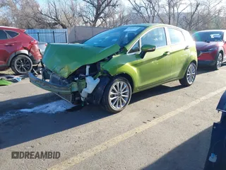 2018 Ford Fiesta Titanium z VIN 3FADP4FJ2JM142861, wystawiony jako IAAI lot #41860660 z przebiegiem 20 820 mil mil oraz . Historia ofert i sprzedaży dostępna na DreamBid. Obrazek 2.