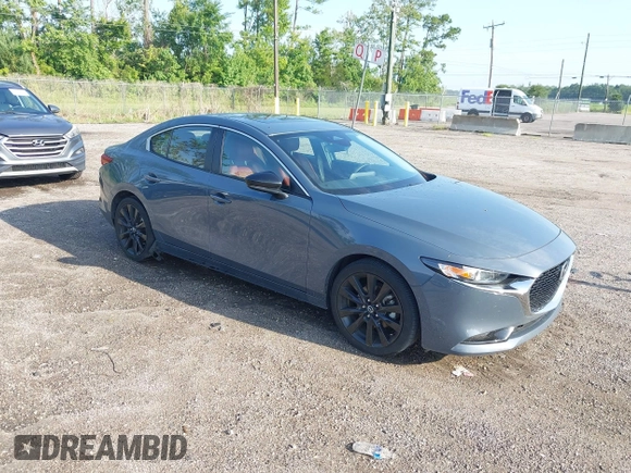 2024 Mazda 3 S Carbon Edition with VIN 3MZBPBCM6RM411828, listed as a IAAI auction lot 42802141 with 40,061 mi miles and . Bid and sale history available at DreamBid. Image 1.