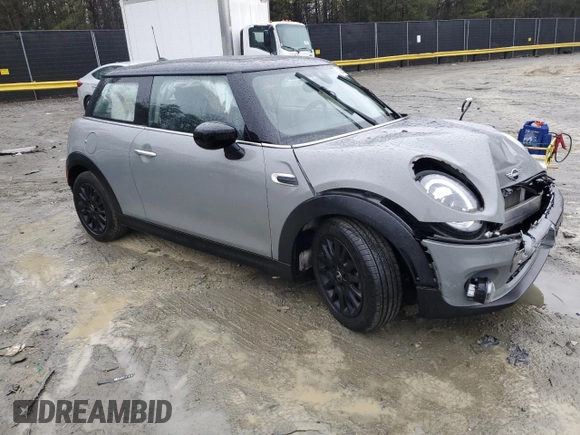 2021 MINI Hardtop Cooper with VIN WMWXR3C04M2N98103, listed as a Copart auction lot 42589255 with 61,317 mi miles and Salvage title. Bid and sale history available at DreamBid. Image 4.