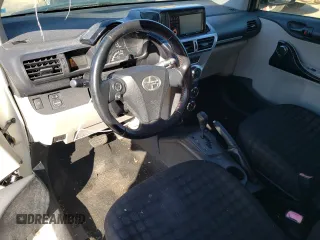 2012 Scion iQ with VIN JTNJJXB00CJ020346, listed as a Copart auction lot 80783494 with 142,577 mi miles and Salvage Title. Bid and sale history available at carsss.com. Image 8.