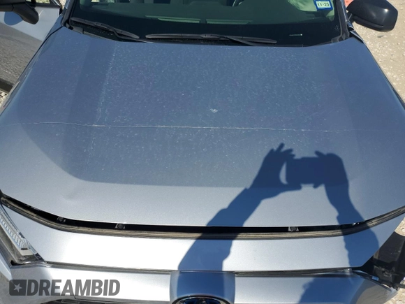2023 Toyota RAV4 Hybrid LE with VIN JTMLWRFV0PD207803, listed as a Copart auction lot 55694695 with 13,198 mi miles and Salvage title. Bid and sale history available at DreamBid. Image 12.