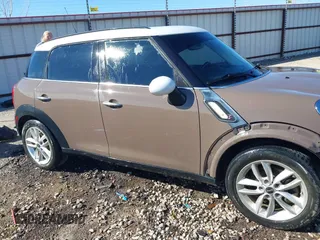 2014 MINI Countryman S with VIN WMWZC3C5XEWP52054, listed as a IAAI auction lot 41452354 with 104,873 mi miles and . Bid and sale history available at DreamBid. Image 14.