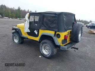 2000 Jeep Wrangler Sport with VIN 1J4FA49S9YP736984, listed as a IAAI auction lot 42055385 with 191,910 mi miles and . Bid and sale history available at DreamBid. Image 3.