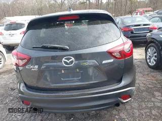 2016 Mazda CX-5 Grand Touring z VIN JM3KE4DY5G0836891, wystawiony jako IAAI lot #41441065 z przebiegiem 120 808 mil mil oraz . Historia ofert i sprzedaży dostępna na DreamBid. Obrazek 16.