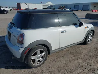 2009 MINI Cooper Hardtop with VIN WMWMF33569TZ20989, listed as a IAAI auction lot 41994772 with 152,944 mi miles. Bid and sale history available at carsss.com. Image 4.