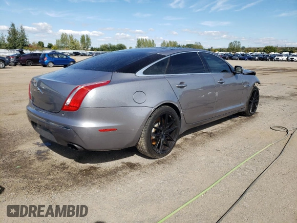 2011 Jaguar XJ with VIN SAJXA2GE5BMV13122, listed as a Copart auction lot 73113044 with 164,196 mi miles and Salvage Title. Bid and sale history available at DreamBid. Image 3.