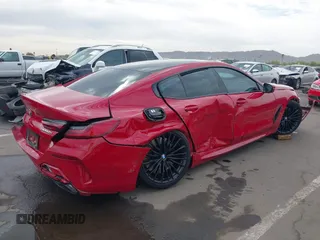 2022 BMW 8 Series M850i z VIN WBAGV8C04NCH90015, wystawiony jako IAAI lot #42020711 z przebiegiem 39 801 mil mil oraz . Historia ofert i sprzedaży dostępna na DreamBid. Obrazek 6.