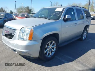 2013 GMC Yukon SLT with VIN 1GKS1CE07DR157076, listed as a IAAI auction lot 41557228 with 148,242 mi miles. Bid and sale history available at carsss.com. Image 2.
