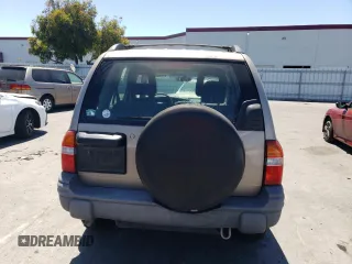 2002 Chevrolet Tracker z VIN 2CNBJ13C026951435, wystawiony jako Copart lot #57782784 z przebiegiem 132 279 mil mil oraz Szkody całkowita. Historia ofert i sprzedaży dostępna na DreamBid. Obrazek 6.