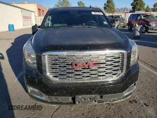 2018 GMC Yukon Denali with VIN 1GKS1CKJ0JR106589, listed as a Copart auction lot 79977034 with 98,022 mi miles and Salvage Title. Bid and sale history available at carsss.com. Image 5.