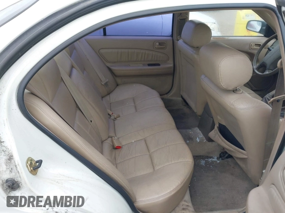 1999 Nissan Maxima GXE with VIN JN1CA21D7XT811913, listed as a IAAI auction lot 42374679 with 209,172 mi miles and . Bid and sale history available at DreamBid. Image 8.
