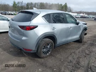 2021 Mazda CX-5 Touring with VIN JM3KFBCM9M1329806, listed as a IAAI auction lot 41825123 with 59,300 mi miles. Bid and sale history available at carsss.com. Image 4.