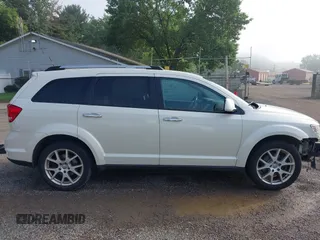 2013 Dodge Journey Crew with VIN 3C4PDCDG0DT591533, listed as a IAAI auction lot 42630548 with 164,961 mi miles and . Bid and sale history available at DreamBid. Image 13.