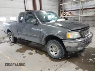 2003 Ford F-150 XL with VIN 1FTRX18W63NB69173, listed as a IAAI auction lot 41618645 with 219,506 mi miles. Bid and sale history available at carsss.com. Image 1.