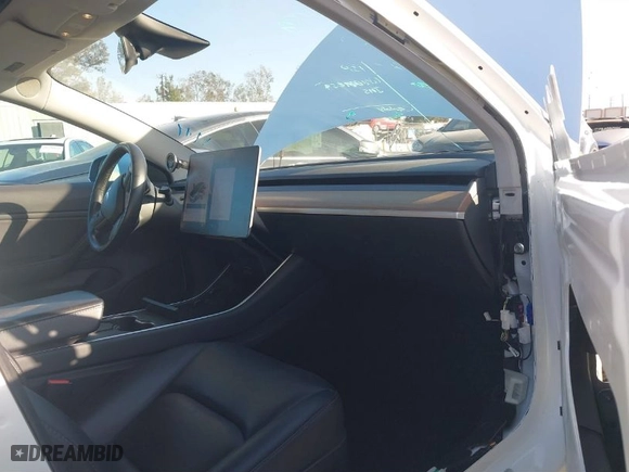 2018 Tesla Model 3 Long Range Battery with VIN 5YJ3E1EA6JF042844, listed as a IAAI auction lot 41349172 with 122,851 mi miles. Bid and sale history available at carsss.com. Image 5.