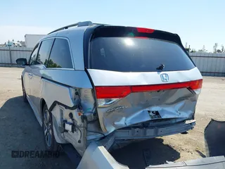 2014 Honda Odyssey Touring with VIN 5FNRL5H91EB068427, listed as a IAAI auction lot 42163315 with 184,134 mi miles and . Bid and sale history available at DreamBid. Image 3.