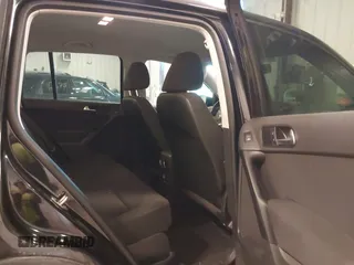 2014 Volkswagen Tiguan SE z VIN WVGAV3AX9EW614094, wystawiony jako IAAI lot #42350601 z przebiegiem 128 996 mil mil oraz . Historia ofert i sprzedaży dostępna na DreamBid. Obrazek 8.