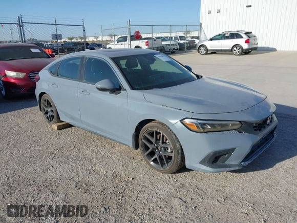 2022 Honda Civic Sport Touring z VIN 19XFL1G89NE009751, wystawiony jako IAAI lot #41845803 z przebiegiem Nie podano mil oraz . Historia ofert i sprzedaży dostępna na DreamBid. Obrazek 1.