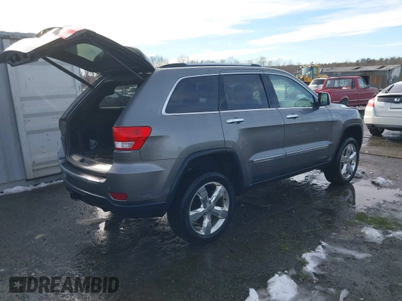 2013 Jeep Grand Cherokee Overland with VIN 1C4RJFCG8DC581719, listed as a IAAI auction lot 41566666 with 152,332 mi miles. Bid and sale history available at carsss.com. Image 4.