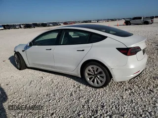 2023 Tesla Model 3 with VIN 5YJ3E1EA4PF631304, listed as a Copart auction lot 52500695 with 33,024 mi miles and Salvage title. Bid and sale history available at DreamBid. Image 2.