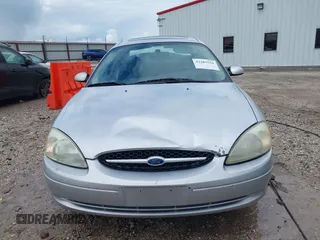 2003 Ford Taurus SES Standard z VIN 1FAFP55S43G270637, wystawiony jako IAAI lot #42205556 z przebiegiem 171 286 mil mil oraz . Historia ofert i sprzedaży dostępna na DreamBid. Obrazek 13.