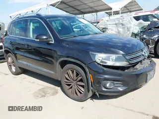 2014 Volkswagen Tiguan SE z VIN WVGAV3AX9EW586653, wystawiony jako IAAI lot #41703396 z przebiegiem 137 298 mil mil oraz . Historia ofert i sprzedaży dostępna na DreamBid. Obrazek 1.