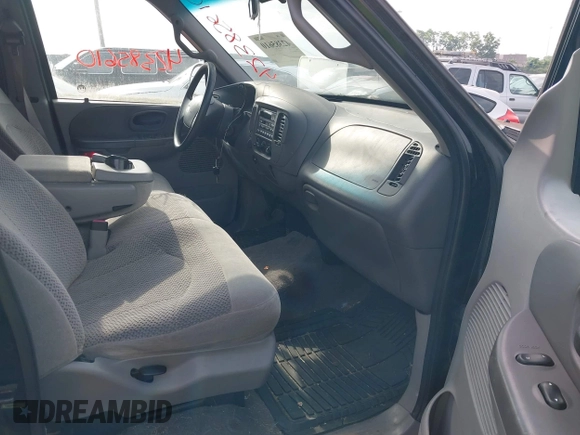 2001 Ford F-150 XLT with VIN 1FTRW08L61KD90032, listed as a IAAI auction lot 42385610 with 164,252 mi miles and . Bid and sale history available at DreamBid. Image 5.